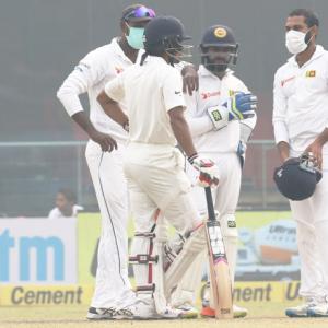 Sri Lanka go behind masks after Kohli's record double