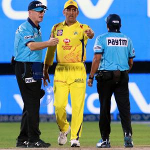 Dhoni loses his cool, storms on to the field