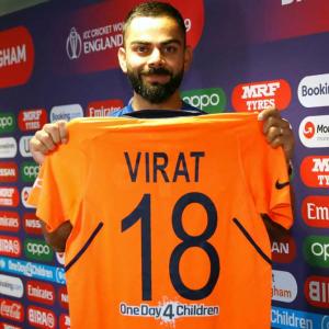 Captain Kohli gives thumbs-up to new orange jersey