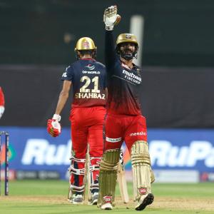 IPL PIX: Karthik, Hazlewood shine as RCB thrash DC