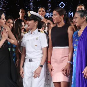 What's Karisma doing with naval officer Pooja Sharma?