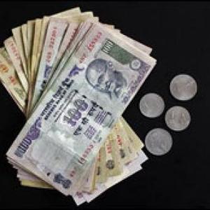 Rupee erases early gains; down 10 paise against dollar