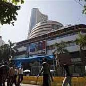 Choppy markets end firm, RBI keeps rates steady