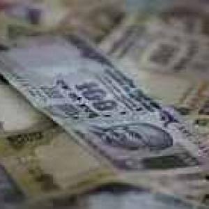 Rupee gains sharply by 71 paise against dollar