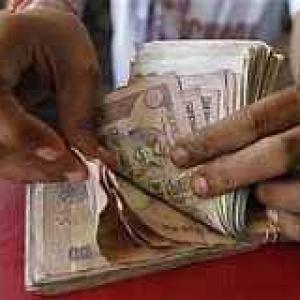 Rupee down 27 paise against dollar in morning trade