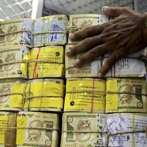 Rupee weakens 14 paise against dollar