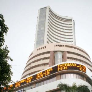 Sensex closes at record high of 21,034