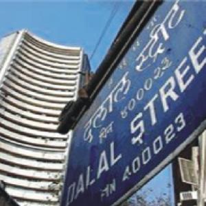 Markets end lower amid volatile trading session