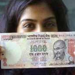 Rupee partially recovers after sinking below 56-mark