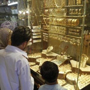 Gold prices plunge by Rs 410 on weak global cues, low demand