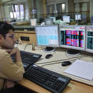 Sensex ends below 21,100 mark; Q3 nos disappoint