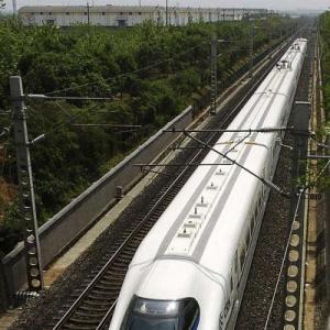 BJP promises bullet trains, 100 new cities, industrial corridors