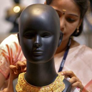 Gold, silver slump on global cues, low demand