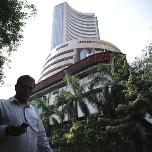 Sensex breaches 22,000 level, then retreats