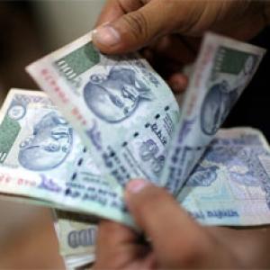 Rupee gains on overseas flows, lack of RBI intervention
