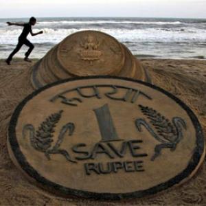Rupee trims initial losses, still down 13 paise