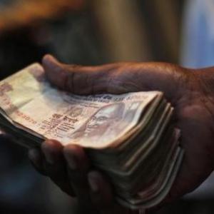 Rupee up 13 paise against dollar in early trade