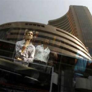 Sensex ends flat amid choppy trade; Nifty above 7,500