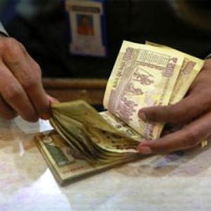 Rupee dips as shares remain under pressure