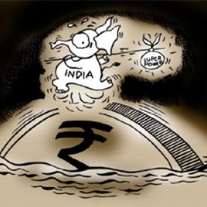 Rupee plunges to 1-week low against USD; falls 14 paise to 63.60