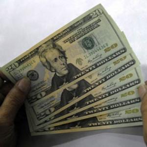 Rupee ends 7 paise lower against dollar