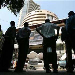 Markets slip into red as RBI keeps rates unchanged, banks fall