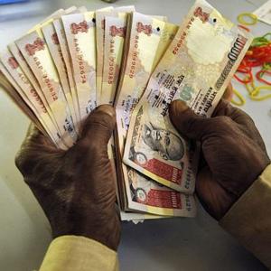 Rupee slips 15 paise against dollar