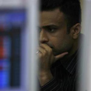 Sensex ends in red, Nifty at 2-week low; telecom shares rally