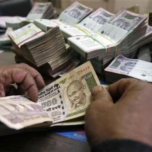 Rupee trims initial losses, still down 17 paise