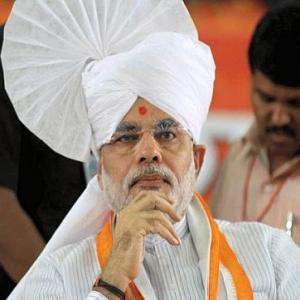 3 factors that stand between Narendra Modi and PM post