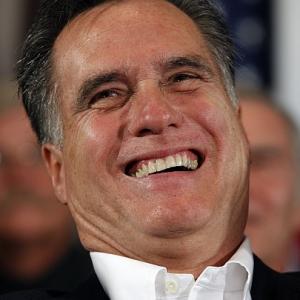 Team Obama slams 'corporate raider' Romney