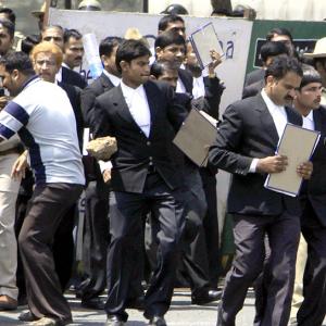 IMAGES: B'luru lawyers attack scribes, cops lathicharge