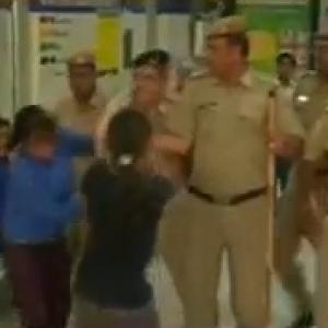 Delhi police ACP slaps girl protester, suspended