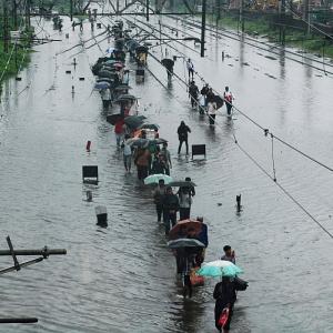 PHOTOS: Heavy rains lash Mumbai; hit rail, road traffic