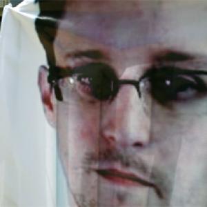 China evades role in Snowden's departure, asks US to explain