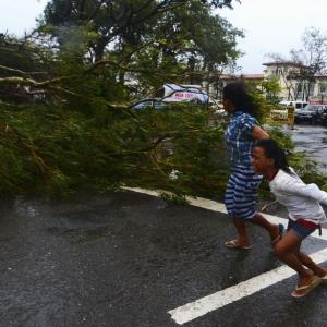 PHOTOS: Over 1200 feared killed as monster typhoon hits Philippines