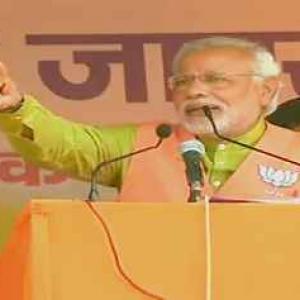 Modi seeks vote for tainted candidate in Bihar