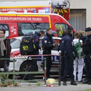 Gunmen kill 12 in French satirical magazine's office in Paris