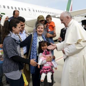 'You are not alone': Pope brings 3 refugee families from Greece to Rome