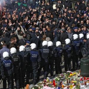 Police fire water cannon at hooligans at Brussels shrine