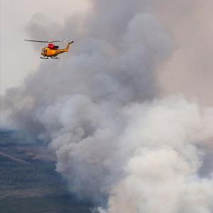 Canadian wildfires grow tenfold; rescuers pray for rain