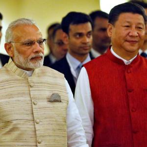 Why Xi is smiling and Modi isn't