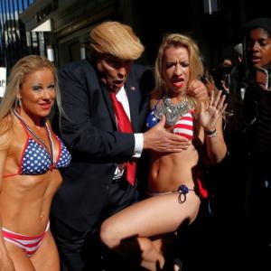 PHOTOS: 'Trump' takes Times Square with a band of bikini-clad babes