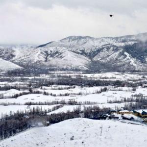PHOTOS: Srinagar turns white after season's first snowfall