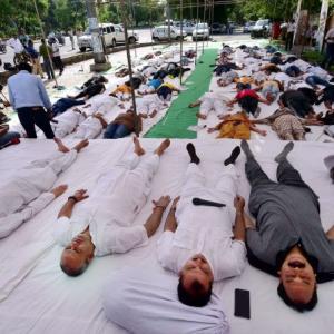 UP farmers perform shavasana in protest