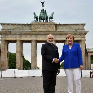 PM poses with Merkel at Brandenburg Gate before leaving Berlin