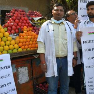Why are these doctors selling fruits?