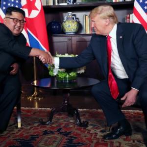 Trump, Kim seal it with a handshake, hold talks