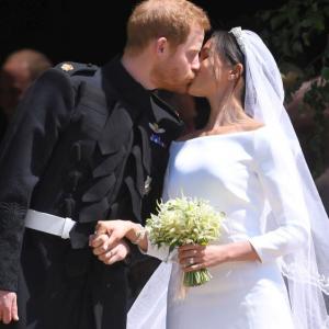 Sealed with a kiss! Harry and Meghan are husband and wife