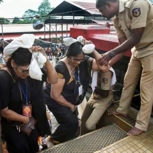 Devotees prevent woman at Sabarimala; police file cases